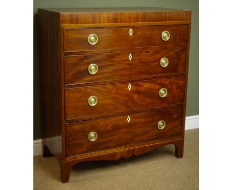 Small George III mahogany chest, inlaid frieze, four graduating drawers with circular brass plate ring handles, shaped apron 