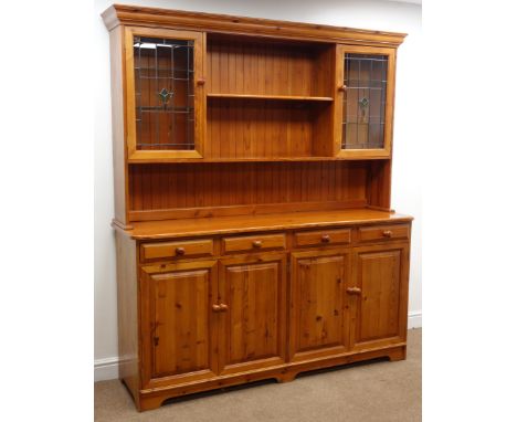 Oregon pine dresser, twin shelf back with two lead glazed cupboards, above four drawers and cupboards, W178cm, H200cm, D49cm 