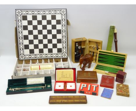 Cased Planimeter and Paul Plus microscope, Bridge set, Backgammon set, card sets, cribbage board, recorder, carved elephant, 