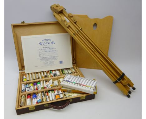 Winsor & Newton picture easel, Artists paint box containing various oils, some unopened, paint pallet & canvas   Condition Re