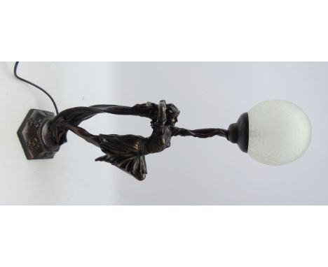Art Deco style bronzed table lamp of a dancer, with globular frosted glass shade on hexagonal base, H70cm