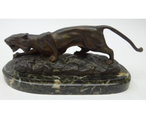 After Antoine Louis Barye, bronzed model of a snarling Tiger on oblong marble plinth, L26cm  Condition Report Click here for 