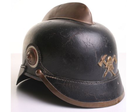 Imperial German Fire Fighters Helmet circa 1914, black leather pickelhaube style shell with brass comb to the top, two nation