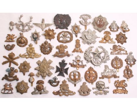 Selection of British Regimental Cap Badges consisting of all brass 7th/8th Battalion PWO West Yorkshire regiment Leeds Rifles