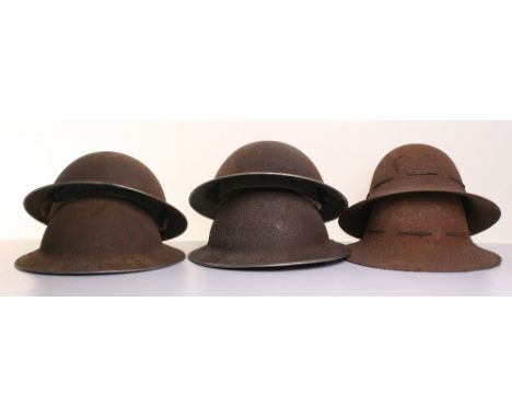 Selection of WW2 British Steel Combat Helmets, consisting of four standard British army combat helmets and two Home Front fir