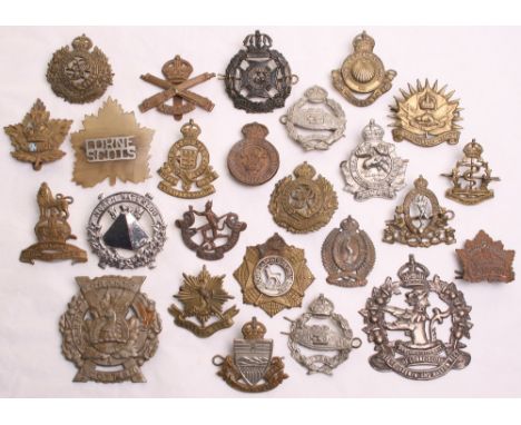 Selection of Mostly Canadian Regimental Cap Badges consisting of bronzed 144th Battalion (Winnipeg Black Devils, Manitoba) Ca