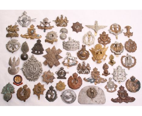 Selection of British Regimental Cap Badges consisting of all brass 23rd Battalion London Regiment with slider fitting on reve