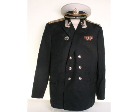 Soviet Russian Naval Commanders Tunic and Peaked Cap, double breasted naval tunic complete with metal rank insignia to the co