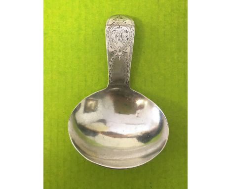 A SILVER CADDY SPOON WITH BRIGHT CUT DECORATION - LONDON 1813