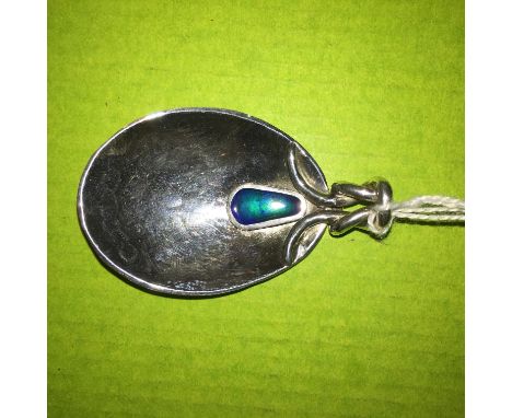 A SILVER ARTS AND CRAFTS REVIVAL CADDY SPOON WITH CABOCHON STONE