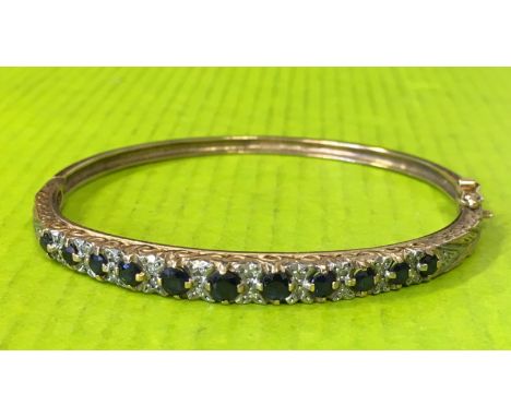 9CT GOLD DIAMOND CHIP AND SAPPHIRE BANGLE WITH SAFETY CLASP 12.9G APPROX