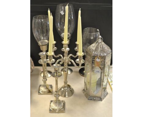 Hurricane lamps; a candelabra; a stainless steel middle Eastern style lantern; candle sticks (7)