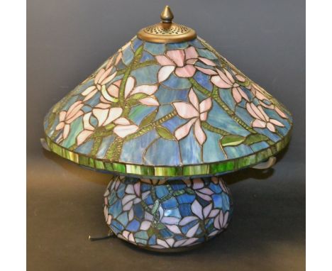 A Tiffany style table lamp decorated with blossom