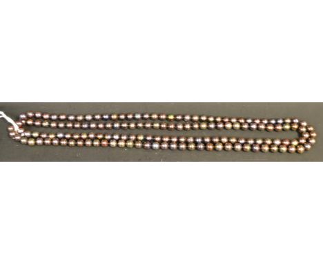 A metallic effect black pearl necklace, 122cm long