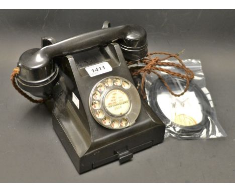 A vintage black Bakelite cradle telephone, No 332L, with conversion kit