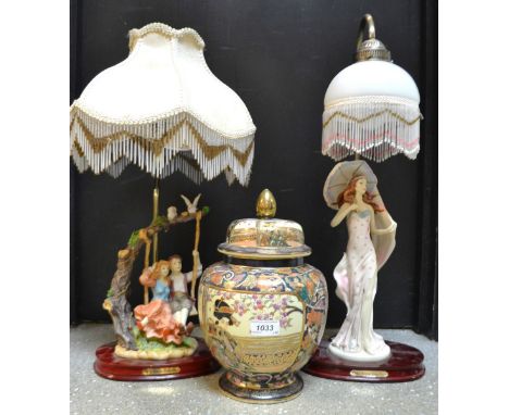 A figural table lamp of children on a swing by Juliana; another similar of a lady; a Oriental temple vase decorated with Geis