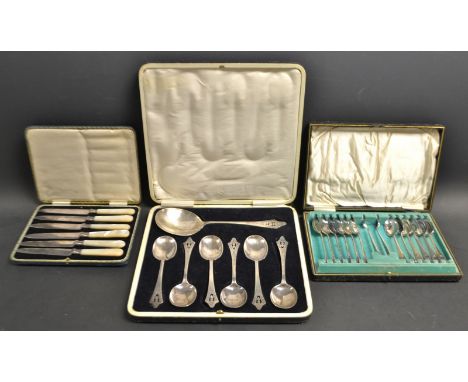 A cased silver plated fruit set; a cased set of 12 teaspoons and nips; cased mother of pearl handled knives with silver mount