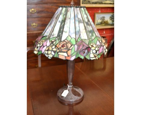 A Tiffany style table lamp , shade decorated with beaded flowers.