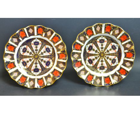 A Royal Crown Derby 1128 Imari fluted dessert plate, first quality; another similar, seconds (2)