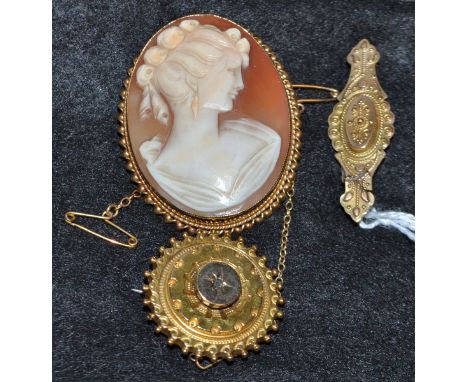 A shell carved cameo brooch, portrait of a Maiden facing left, 9ct gold ridged rope twist frame, Birmingham 1970, 10.2g gross