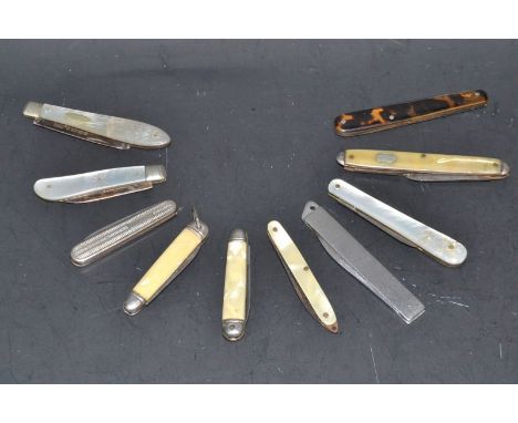 A Victorian silver folding fruit/pocket knife, mother of pearl mounted handle, Birmingham 1876;  another Sheffield 1927;  oth