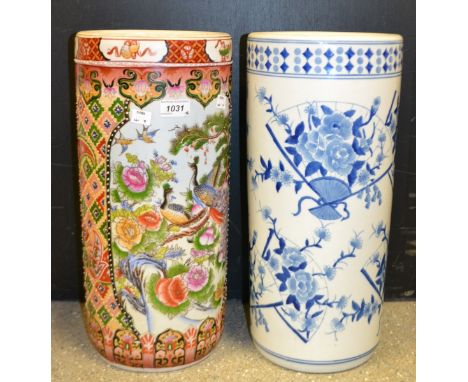 A ceramic umbrella stand decorated with oriental flowers and birds; another similar blue and white fan design (2)