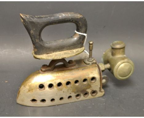 A vintage paraffin/oil iron, cylinder reservoir, removable inner core, pointed wooden handle