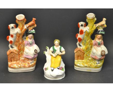 A late 19th Century Staffordshire figure, seated girl with harp; a pair of Staffordshire style spill vases (3)