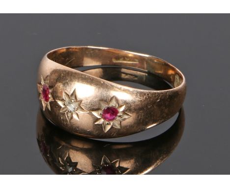 9 carat gold ruby and diamond set ring, with a central rose cut diamond flanked  by rubies, ring size S 1/2