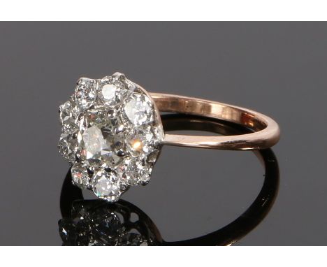 Diamond set cluster ring, the head set with ten diamonds at an estimated total diamond weight of 1.45 carats forming a flower