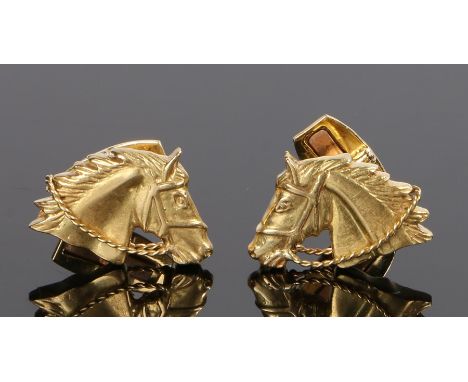 Pair of 18 carat gold cufflinks, with horses heads to the face with a hinged toggle, 22.5 grams, 23mm diameter