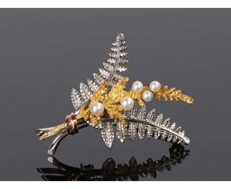9 carat white and yellow gold pearl set brooch, in the form of bound leaves, the front leaf set with pearls, 8.2 grams, 44mm 