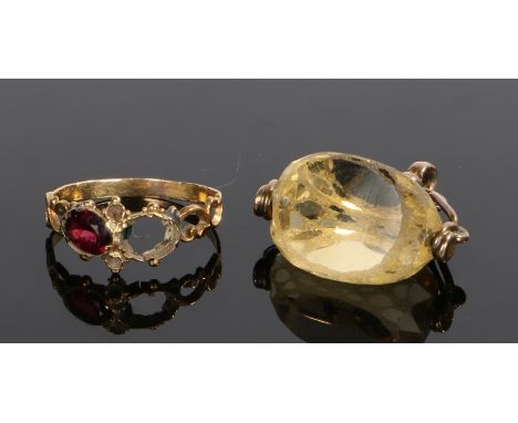 19th Century garnet set ring, with one garnet, the other missing, together with a swivel seal, (2)