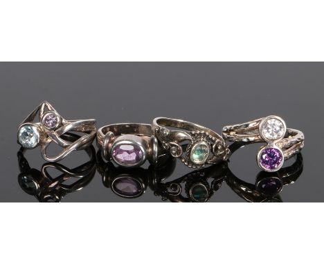 Four silver rings, to include three Art Nouveau style rings and a cross over ring, (4)