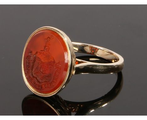 Gold seal ring, the seal with a heraldic crest and Latin script, ring size P