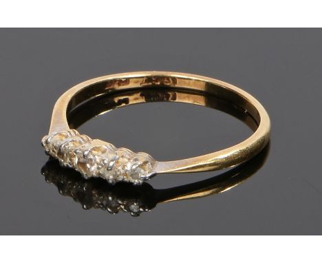 18 carat gold diamond set ring, with a row of five diamonds to the head, ring size P