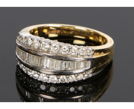 18 carat gold diamond set ring, the head set with round and baguette cut diamonds at a total of 1 carat, ring size O