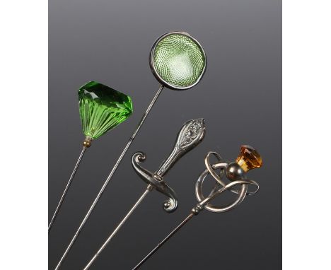 Four vintage hat pins: a Charles Horner silver hat pin with a citrine &amp; twist design, Chester 1911; a silver sword shaped