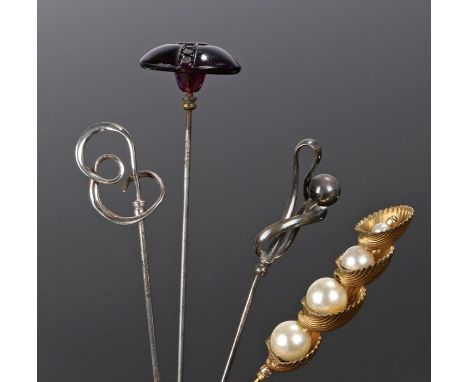 Four vintage hat pins; a Charles Horner silver hat pin with a twisted loop design hallmarked Chester 1907, a Charles Horner s