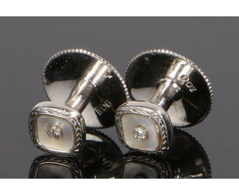 Cased pair of 9 carat white gold collar studs, with mother of pearl centres, 2.2 grams, cased
