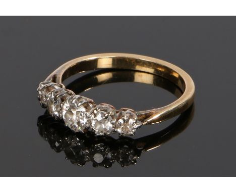 Diamond set ring, with five round cut diamonds to the head set to yellow metal, ring size L