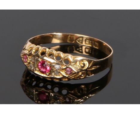 18 carat gold diamond and spinel ring, the central pink spinel flanked by diamonds and further spinels, ring size Q