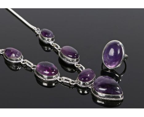 Amethyst jewellery, to include a necklace with pear and oval stones together with a conforming ring, (2)