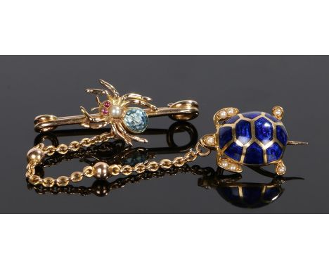 Ruby and pearl brooch and pin set, the brooch having a spider with ruby eyes and a pearl body, the drop chain with a blue ena