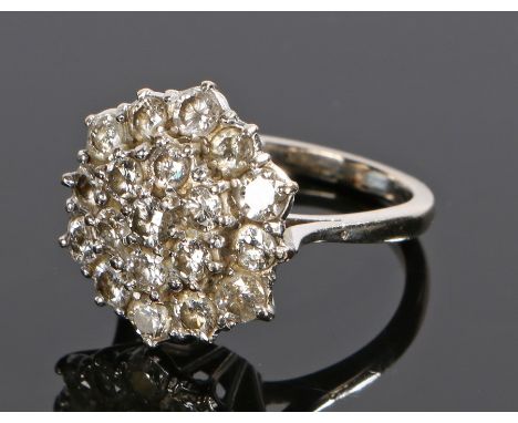 Diamond cluster ring, in the form of a flower head set with nineteen round cut diamonds to the white metal shank, ring size N