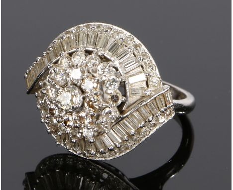 Diamond cluster ring, with round and baguette cut diamonds at a total of approximately 4.5 carats in total on a white metal s