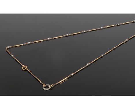 18 carat gold pearl and diamond set pocket watch chain/necklace, the clip end with bar chain and pearl links with a diamond s