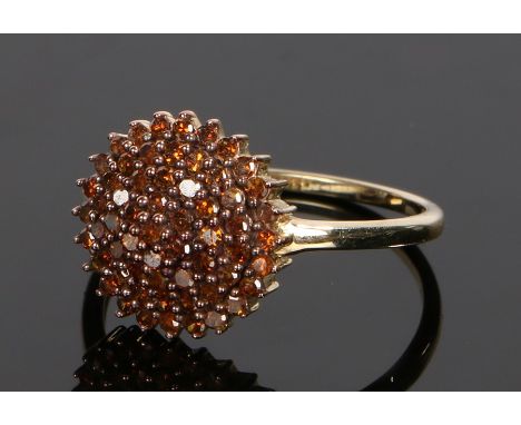 9 carat gold red diamond set ring, the dome head set with red diamonds, ring size N 1/2