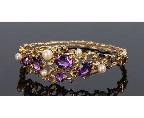 9 carat gold amethyst and pearl set bracelet, the amethyst and pearls set to a wriggle design, 22.5 grams, 68mm diameter  