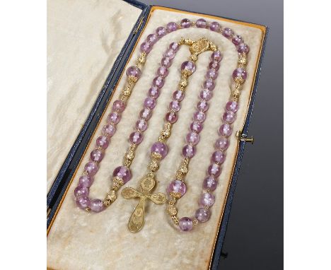 Amethyst and yellow metal rosary beads, with a row of beads to the yellow metal ball links and rose decorated cross, 52cm lon